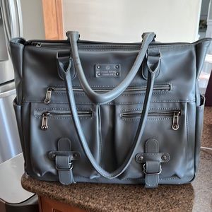 A gorgeous 6 pack bag with cat bite marks on handle